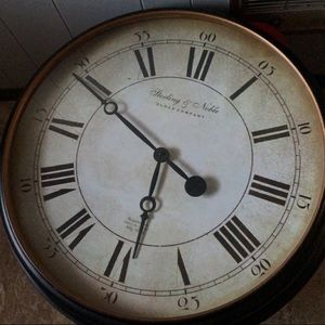 Brown clock 29 inches across